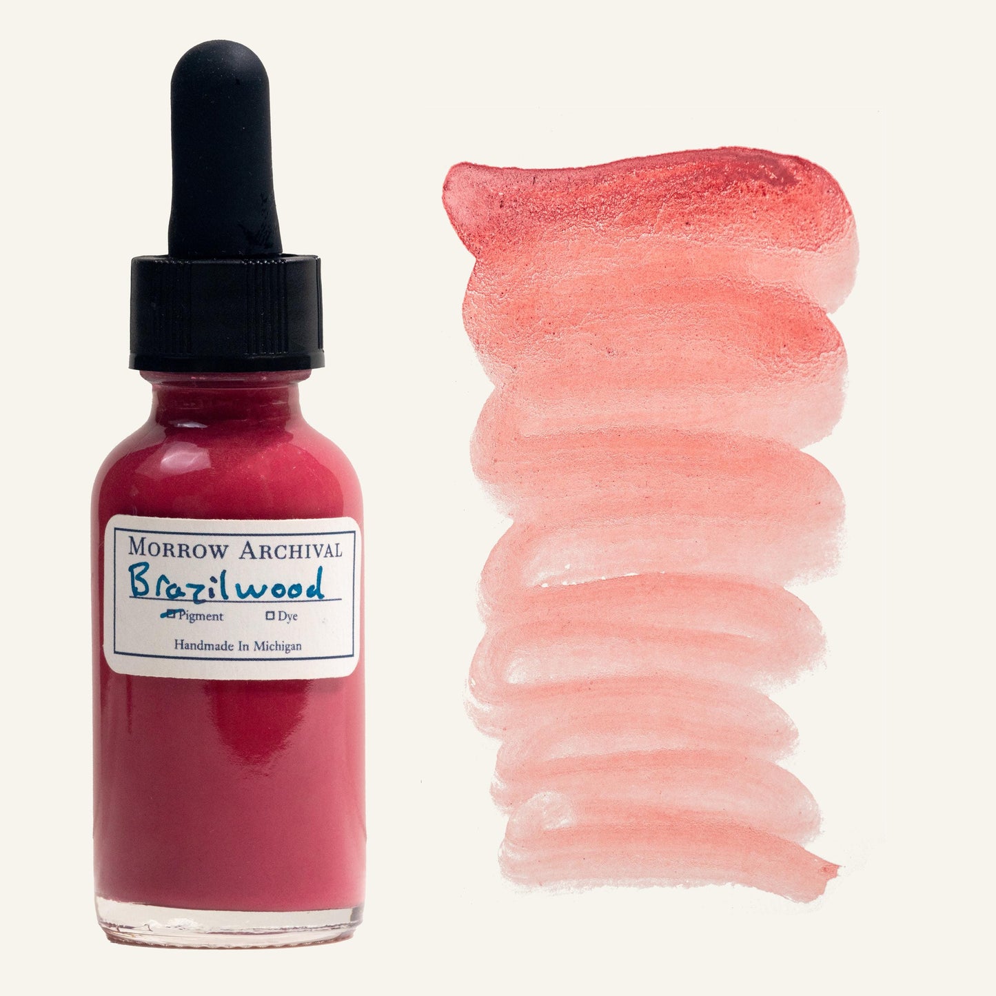 Historical medieval watercolor ink made with Brazilwood and Sappanwood Pink Lake pigment in a clear glass dropper bottle, labeled with high-quality watercolor paper and a hand-applied swatch. This organic, natural ink has a rich rose-pink hue with subtle warmth and depth. The swatch beside the bottle displays the ink’s fluidity and gradient from deep magenta to soft blush. Archival quality, ideal for calligraphy, illumination, and historical painting.