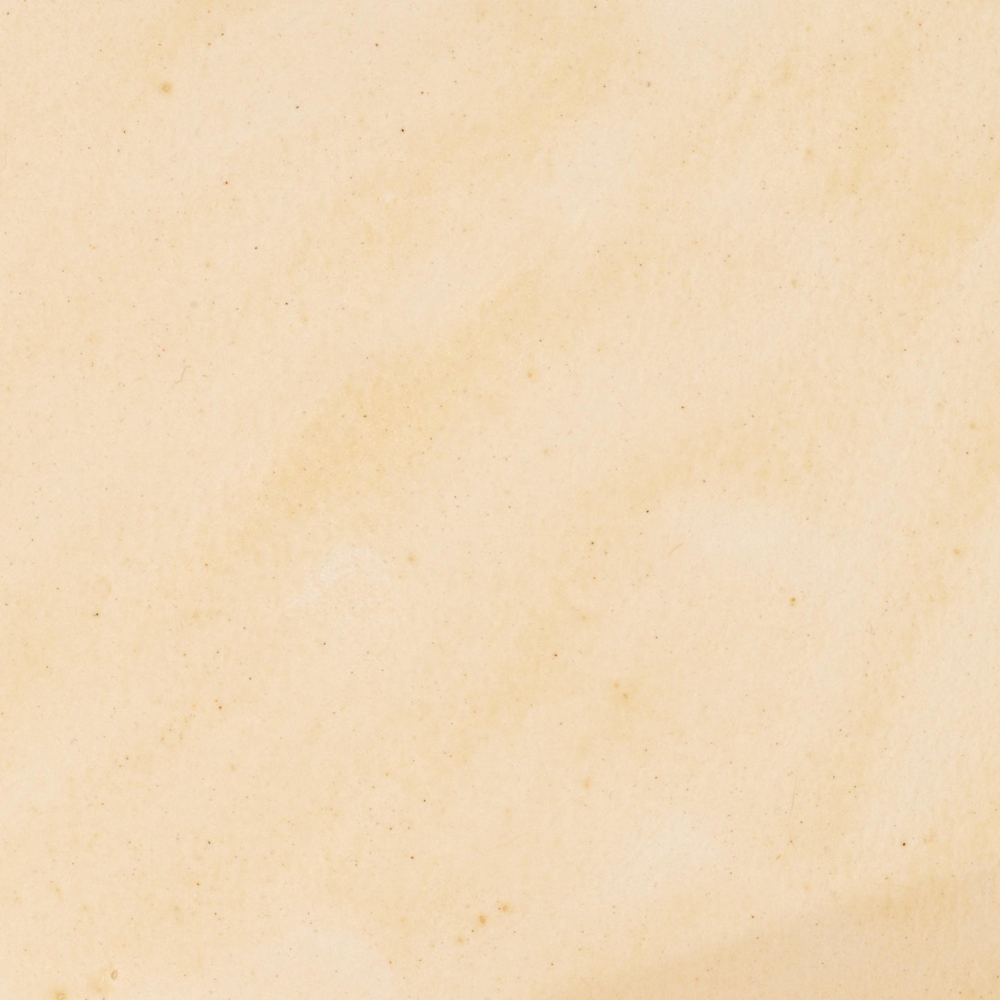 Watercolor painting in soft, creamy Ivory Travertine, a natural earth pigment inspired by pale travertine limestone formations. Subtle mineral warmth with excellent lightfastness and gentle granulation. Handcrafted with pure pigment, honey, and gum arabic for archival, professional quality. Ideal for natural palettes, architectural studies, and fine art inspired by historical stone materials.