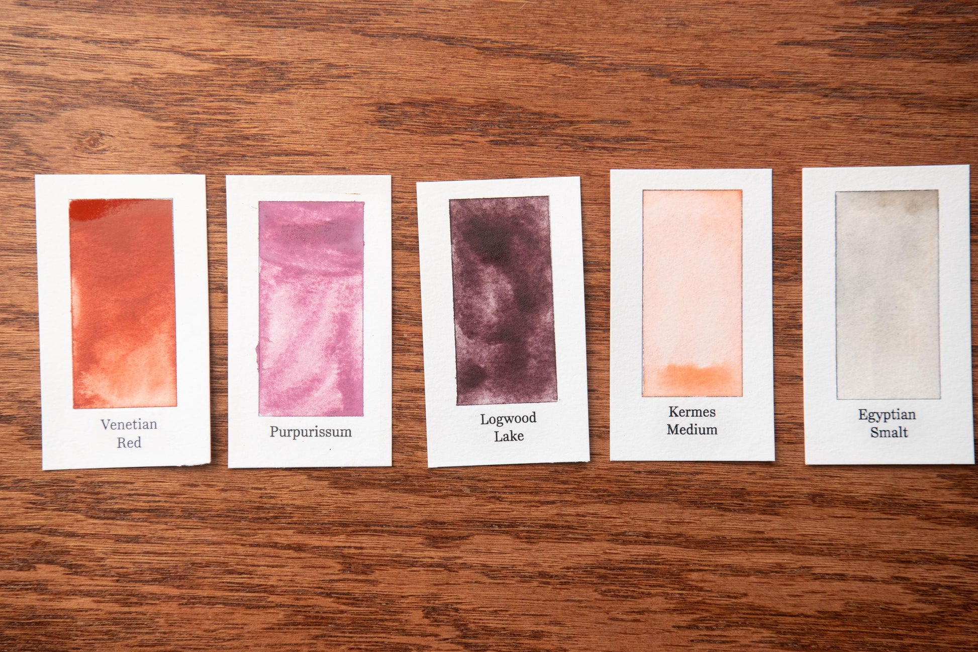 five small cards with different paint color swatches, each labeled with a name of the paint color.