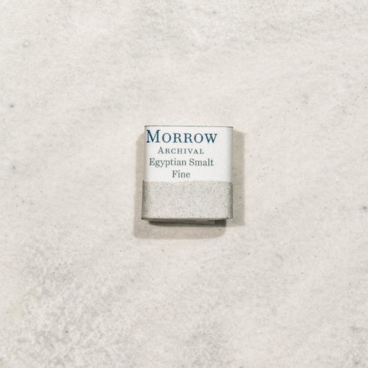 Watercolor painting with a handmade archival watercolor pan with elegant and vibrant label in watercolor paper in Egyptian Fine Smalt, a luminous blue pigment made from ground potassium glass following an ancient Egyptian recipe, lower in cobalt than later European smalts, yielding a softer, sky-toned hue. Handcrafted with honey and gum arabic. Semi-transparent and moderately lightfast, ideal for ancient recreations, fresco-style work, and soft celestial tones in historical palettes.