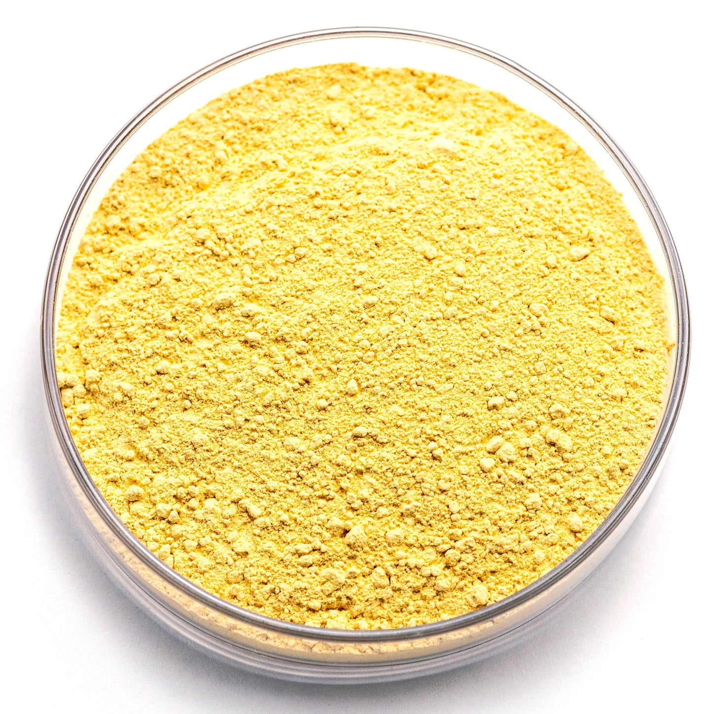 A clear glass bowl filled with a yellow substance, possibly a powder or granular material.