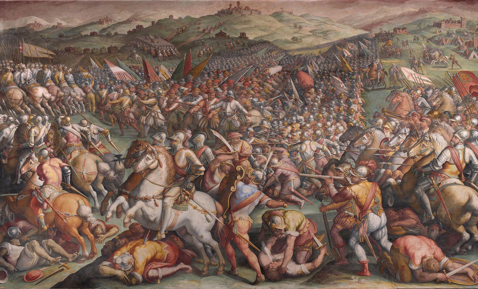 a large group of people on horseback engaged in a battle, with some individuals wielding swords and others armed with spears. The scene is set in a mountainous landscape, with buildings visible in the background.