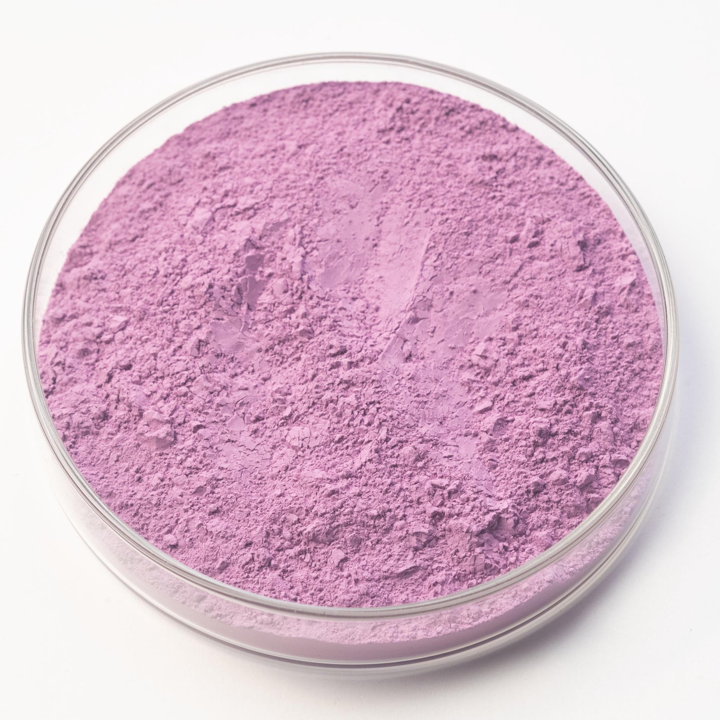 A round glass dish contains bright purple Potter's Violet Pigment, displayed on a plain white background.