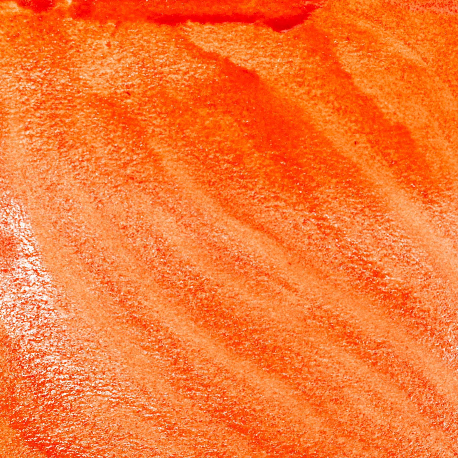 Watercolor swatch in Orange Realgar, a vivid orange-red historic pigment made from natural arsenic sulfide (As‚ÇÑS‚ÇÑ), traditionally used in ancient China, medieval Europe, and alchemical manuscripts. This handmade watercolor is crafted with honey and gum arabic, offering a bold, opaque tone with moderate lightfastness‚Äîideal for illuminated manuscripts, dramatic accents, and historical color recreations.