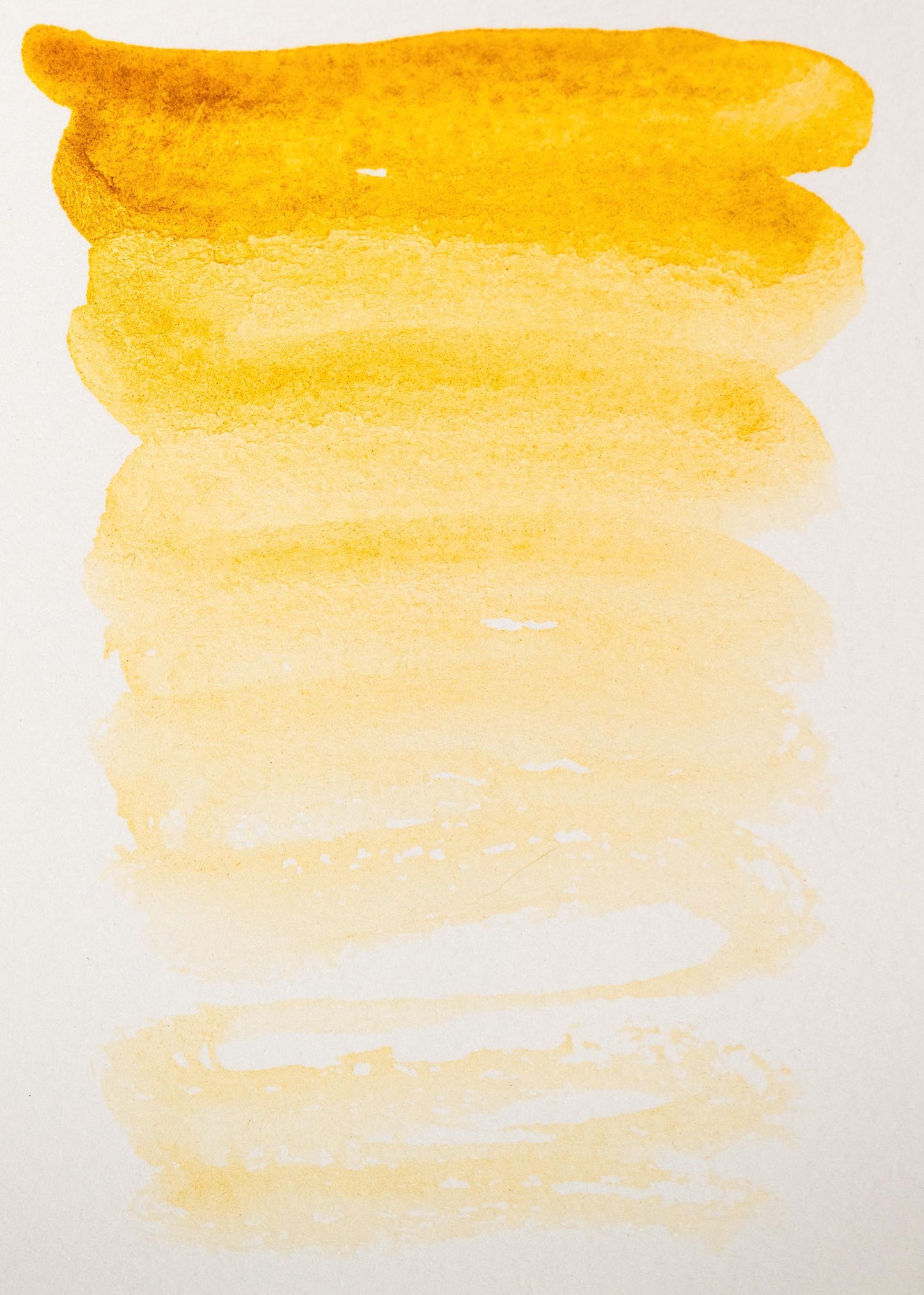 Golden earth swatch of Yellow Ochre ink, fading from bold ochre to a soft wheat tone. This traditional mineral pigment provides warm natural coverage with a matte finish, perfect for foundational washes and historical pigment-based artwork.