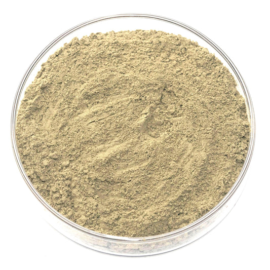 A glass bowl filled with a light brown substance, possibly a type of powder or granular material.