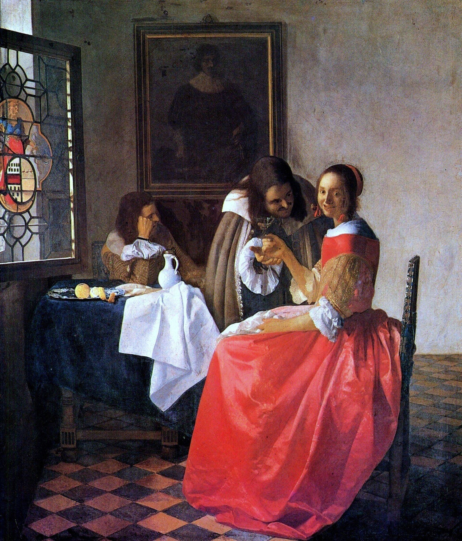 Three people sit in a sunny room with checkered floors. A man offers wine to a smiling woman whose bright red dress glows like Madder Lake Intense Pigment, while another woman sits by the window, her face partly hidden.