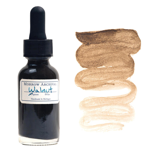 Historical watercolor ink made from Black Walnut Brown Lake pigment, derived from natural walnut husks, presented in a clear glass dropper bottle with an archival watercolor paper label and hand-painted swatch. This rich botanical ink offers a deep brown tone with warm undertones and a smooth gradient from dark chocolate to soft golden brown. Archival and lightfast, ideal for calligraphy, manuscript illumination, and nature-inspired historical artwork.