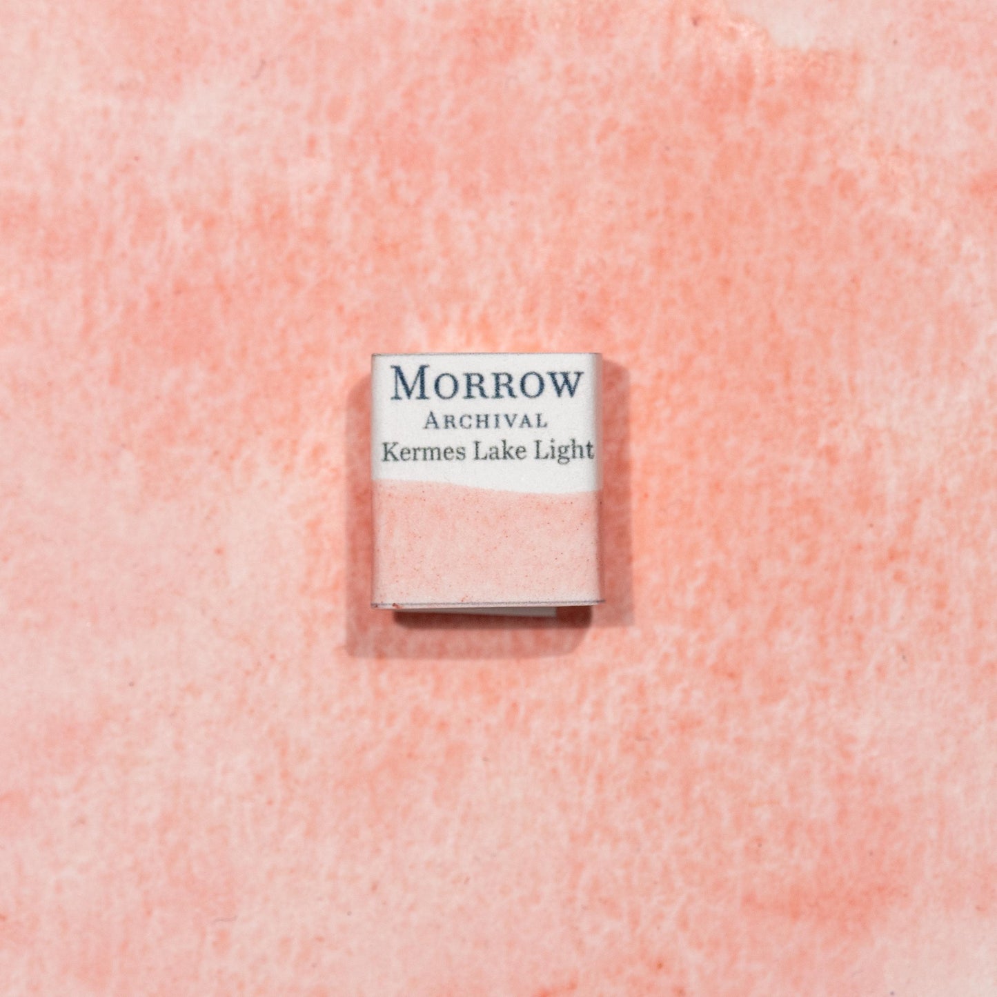 Watercolor painting with a handmade archival watercolor pan with elegant and vibrant label in watercolor paper in Kermes Lake, a rich crimson pigment made from the Kermes insect (Kermes vermilio), one of the earliest known sources of red dye in the Mediterranean and Middle East. Handcrafted with honey and gum arabic. Transparent and historically lightfast, ideal for manuscript illumination, medieval European palettes, and deep crimson glazes.