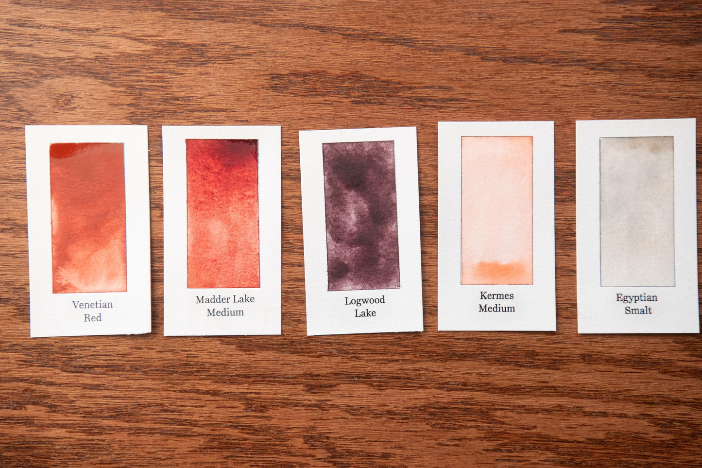 five small cards with different paint color swatches, each labeled with a name of the paint color.