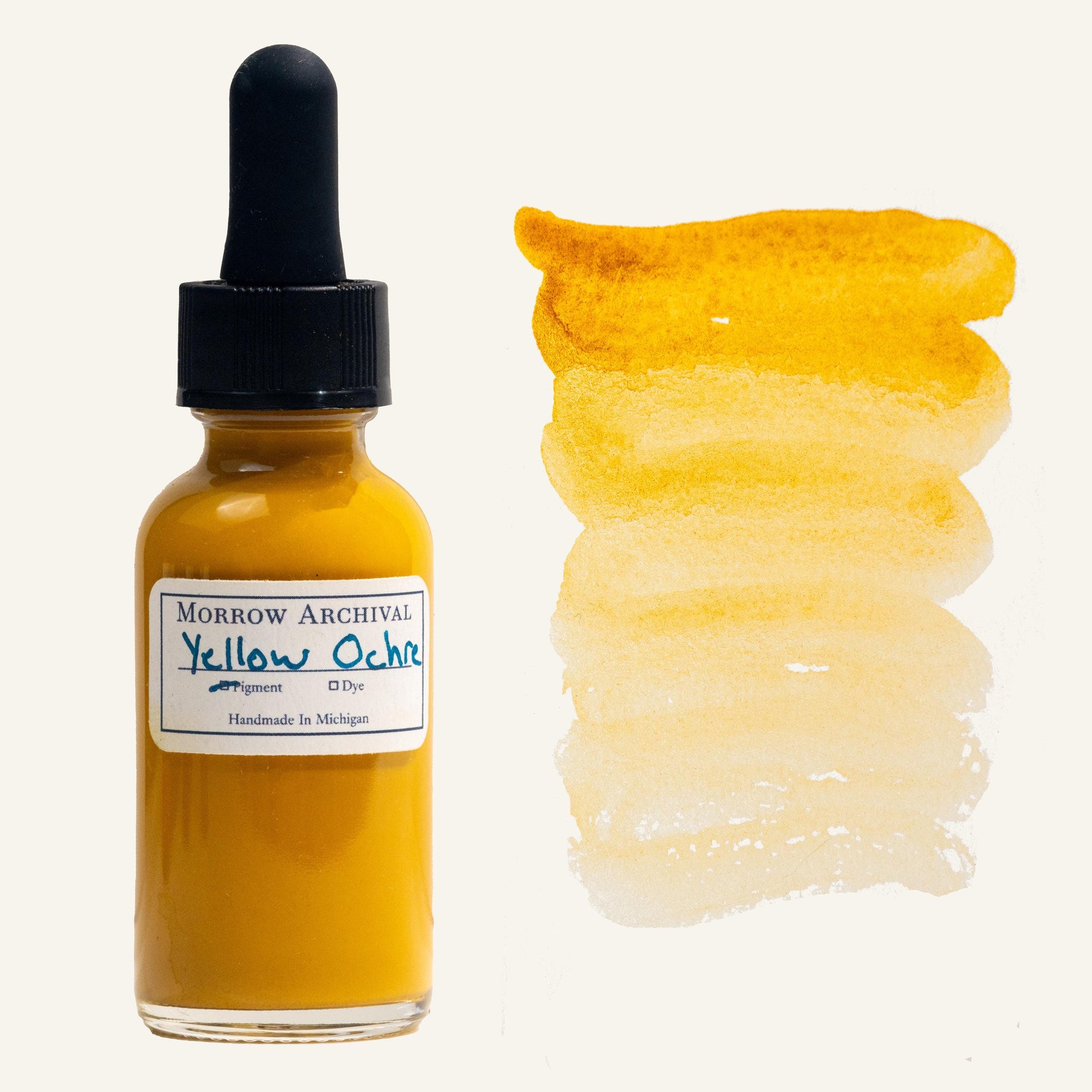 Natural watercolor ink made from Yellow Ochre earth pigment, housed in a clear glass dropper bottle with a hand-labeled archival watercolor paper tag and painted swatch. This classic golden-yellow ink is sourced from iron-rich natural deposits, offering a warm, earthy tone with soft opacity and smooth layering. The swatch shows a gradient from deep golden ochre to a light wheat wash. Archival quality, perfect for traditional art, historical illustration, and natural pigment work.