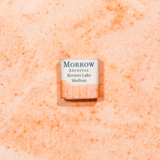 Watercolor painting with a handmade archival watercolor pan with elegant and vibrant label in watercolor paper in Kermes Lake, a rich crimson pigment made from the Kermes insect (Kermes vermilio), one of the earliest known sources of red dye in the Mediterranean and Middle East. Handcrafted with honey and gum arabic. Transparent and historically lightfast, ideal for manuscript illumination, medieval European palettes, and deep crimson glazes.