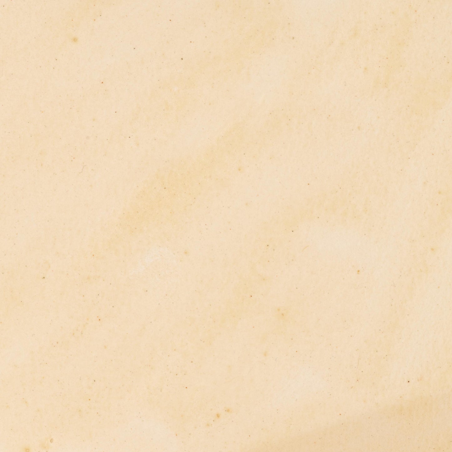Watercolor painting in soft, creamy Ivory Travertine, a natural earth pigment inspired by pale travertine limestone formations. Subtle mineral warmth with excellent lightfastness and gentle granulation. Handcrafted with pure pigment, honey, and gum arabic for archival, professional quality. Ideal for natural palettes, architectural studies, and fine art inspired by historical stone materials.