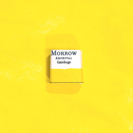 Handmade True Gamboge natural watercolor paint half pan shown on a textured watercolor painting. Made from pure single-pigment gamboge tree resin, this vibrant golden yellow offers rich transparency and smooth flow, ideal for botanical art, historical painting, and fine art illustration. A rare and beautiful eco-friendly gift for watercolor artists and collectors seeking small-batch, archival-quality, all-natural handmade pigments rooted in centuries of artistic tradition.