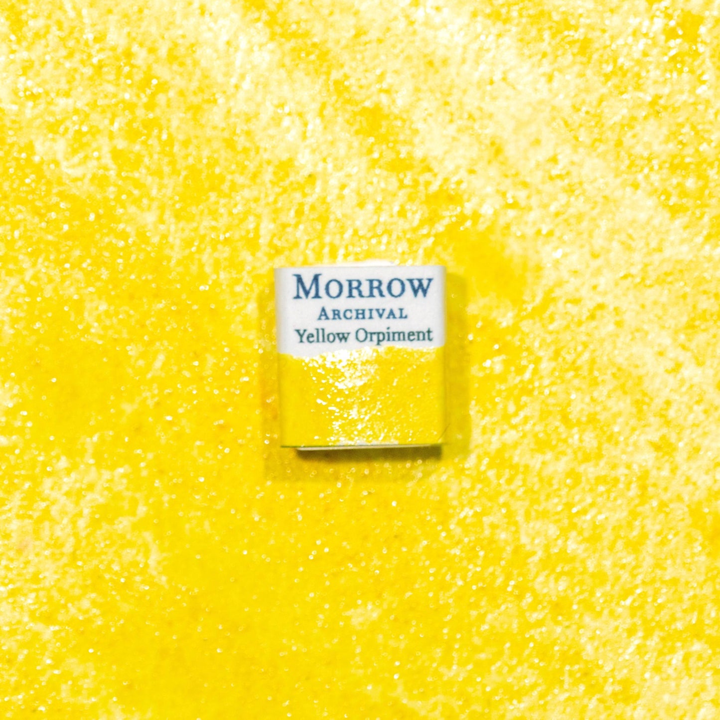 Watercolor painting with a handmade archival watercolor pan with elegant and vibrant label in watercolor paper in Natural Yellow Orpiment, a brilliant golden-yellow pigment derived from the mineral arsenic sulfide (As‚ÇÇS‚ÇÉ), historically treasured in ancient China, Persia, and Europe for its unmatched luminosity. Handcrafted with honey and gum arabic. Opaque and historically lightfast, ideal for illuminated manuscripts, Eastern miniature painting, and bold golden highlights.