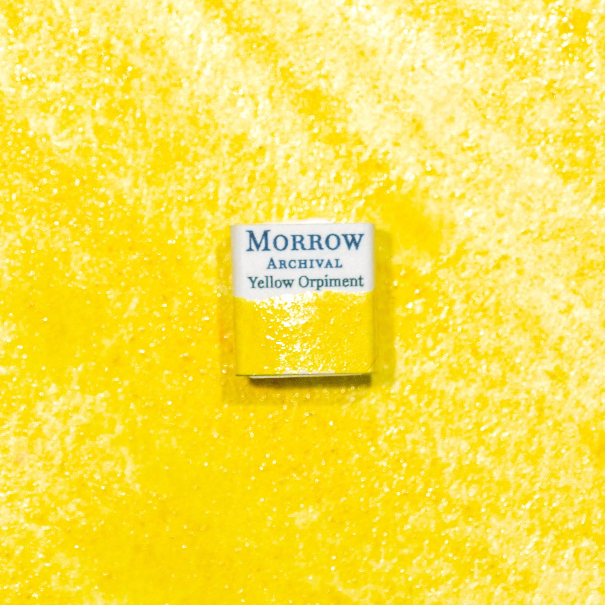 Watercolor painting with a handmade archival watercolor pan with elegant and vibrant label in watercolor paper in Natural Yellow Orpiment, a brilliant golden-yellow pigment derived from the mineral arsenic sulfide (As‚ÇÇS‚ÇÉ), historically treasured in ancient China, Persia, and Europe for its unmatched luminosity. Handcrafted with honey and gum arabic. Opaque and historically lightfast, ideal for illuminated manuscripts, Eastern miniature painting, and bold golden highlights.