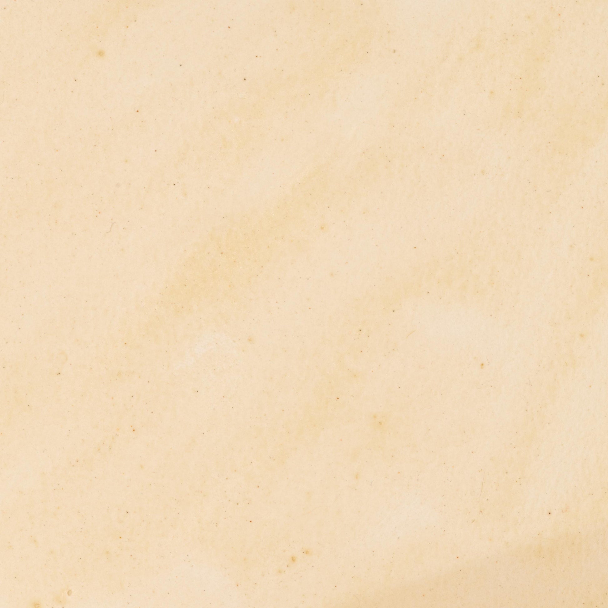 Watercolor painting in soft, creamy Ivory Travertine, a natural earth pigment inspired by pale travertine limestone formations. Subtle mineral warmth with excellent lightfastness and gentle granulation. Handcrafted with pure pigment, honey, and gum arabic for archival, professional quality. Ideal for natural palettes, architectural studies, and fine art inspired by historical stone materials.