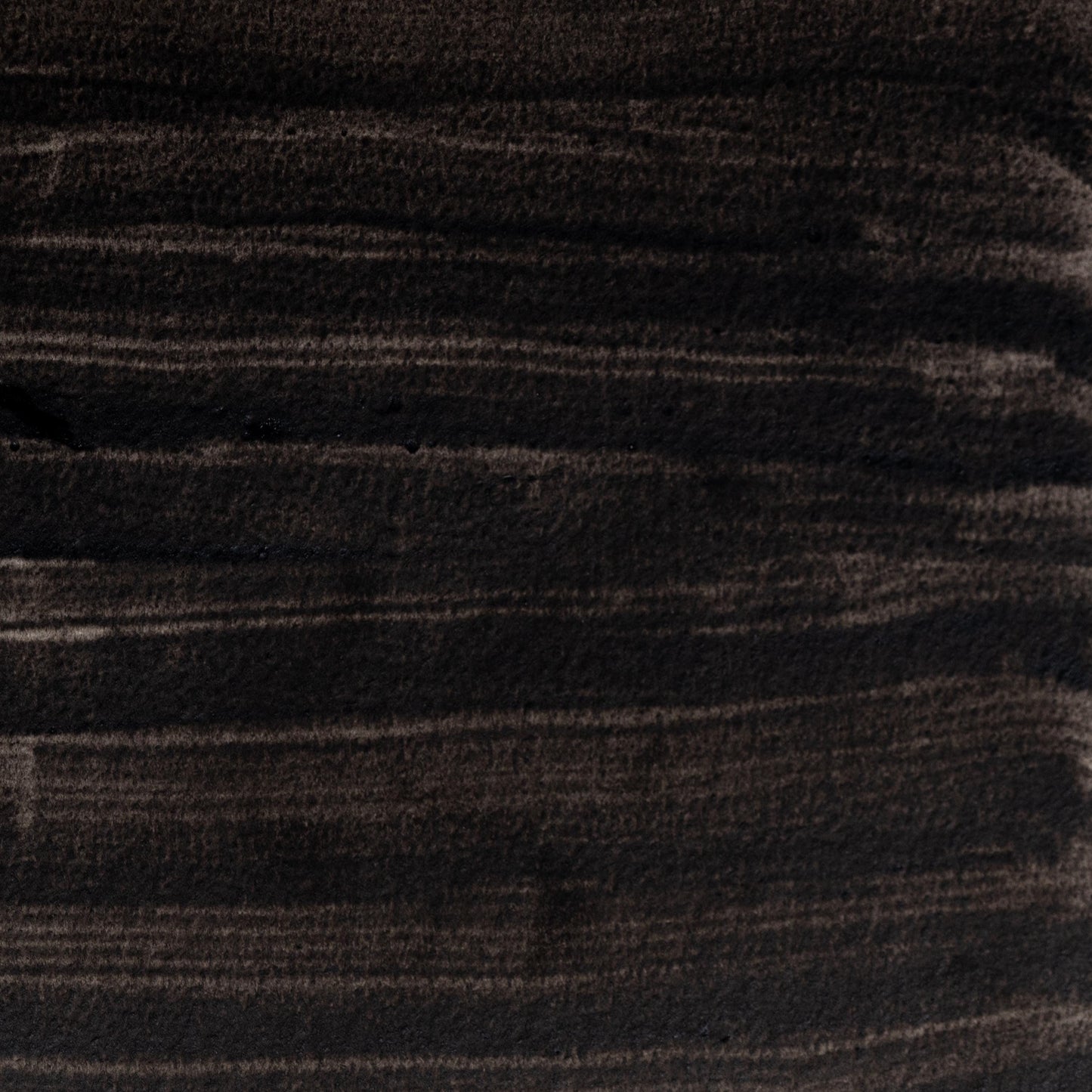 Watercolor painting in deep, matte Roman Black Earth, a natural pigment used in Ancient Roman frescoes and early European painting. Made from charred vegetal or earth sources. Handcrafted with honey and gum arabic. Rich, neutral black perfect for grisaille, historical work, and expressive contrast.