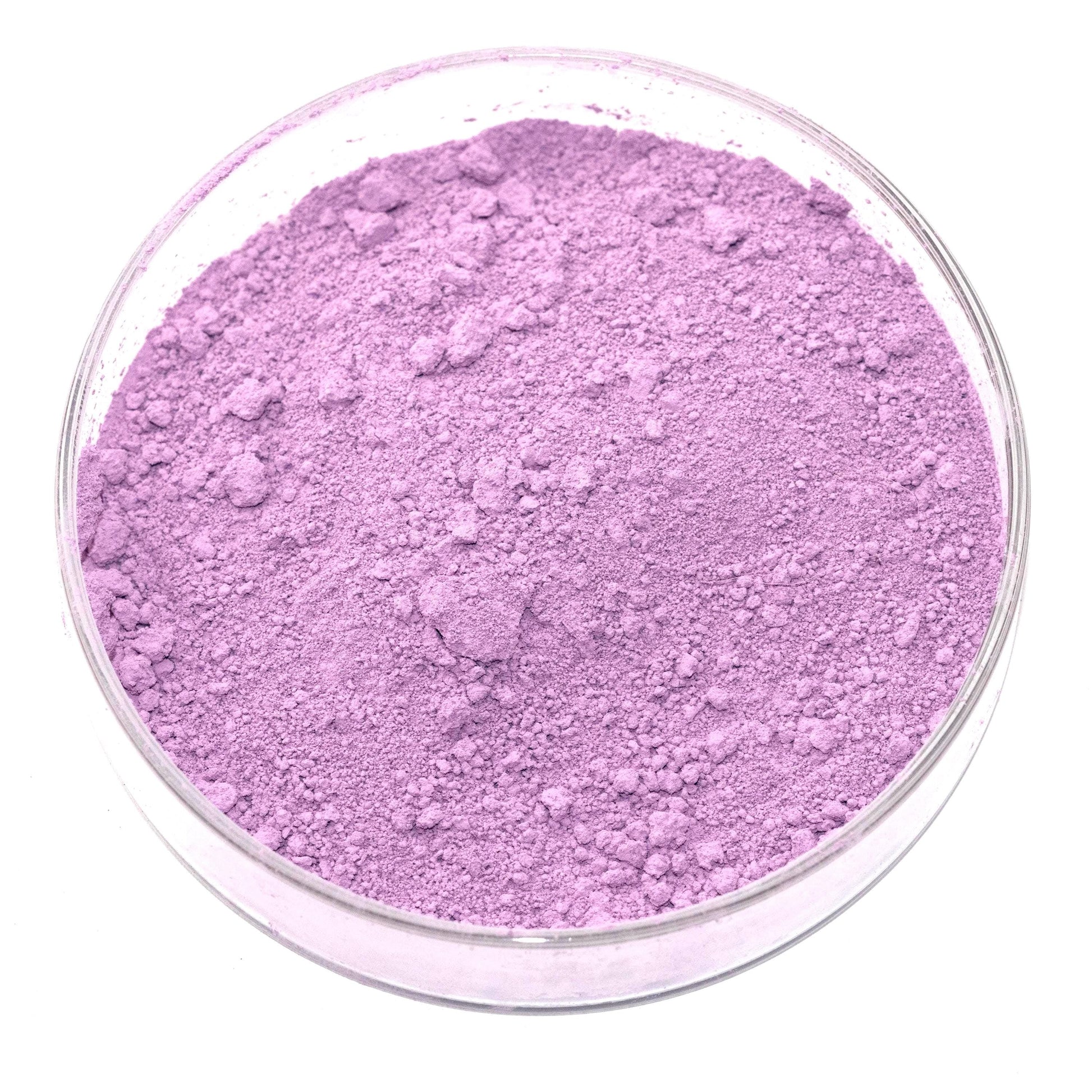 A glass bowl filled with a purple-colored substance, possibly a powder or a solid material.