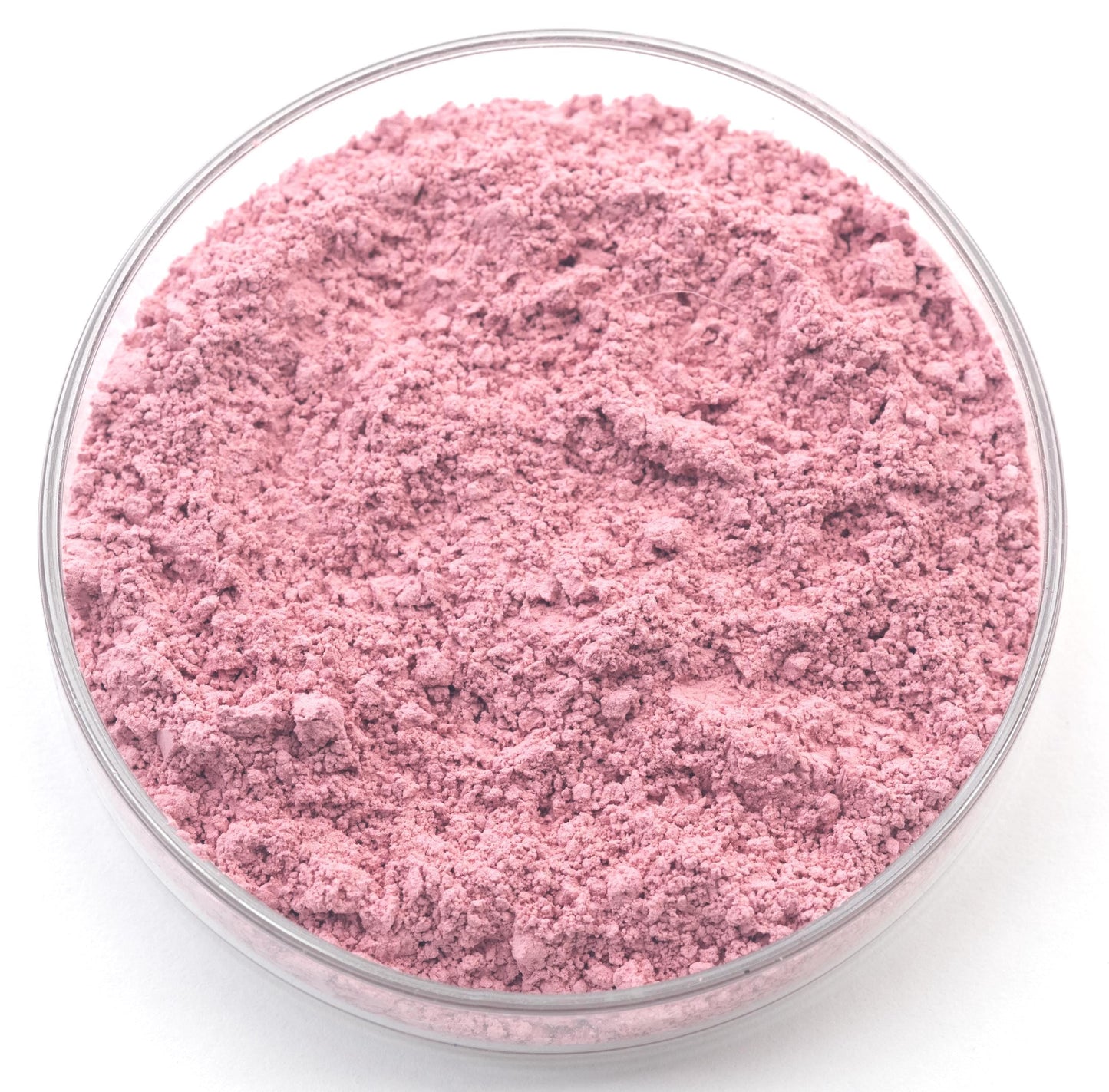 A glass bowl filled with a pink substance, possibly a powder or a solid material.