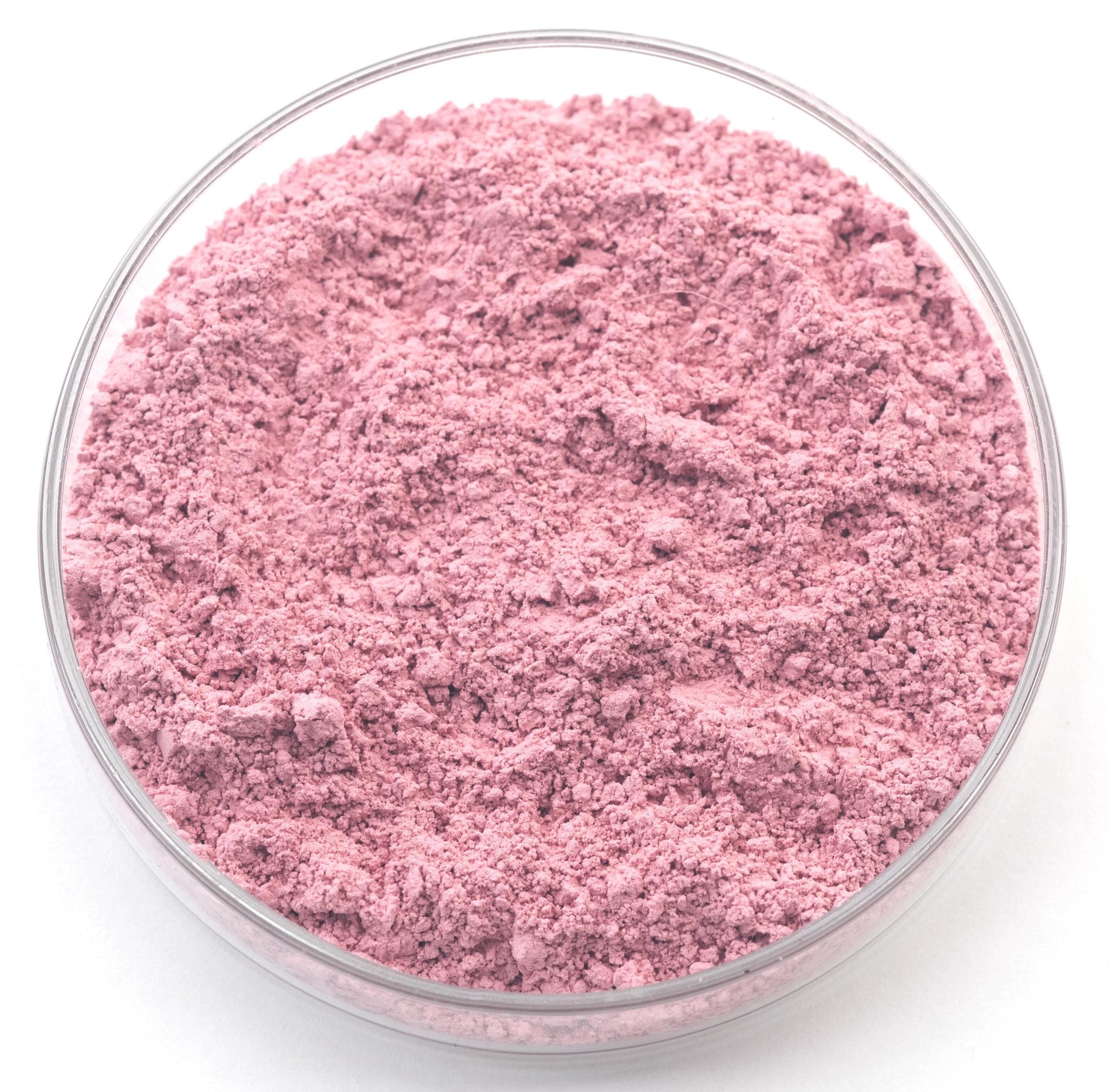 A glass bowl filled with a pink substance, possibly a powder or a solid material.