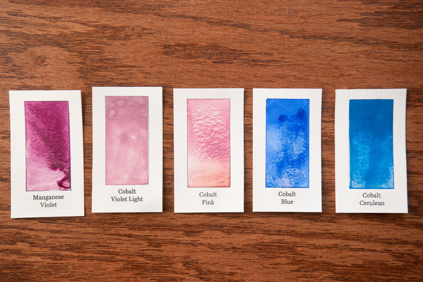 five cards with different paint color swatches, each labeled with the name of the color.