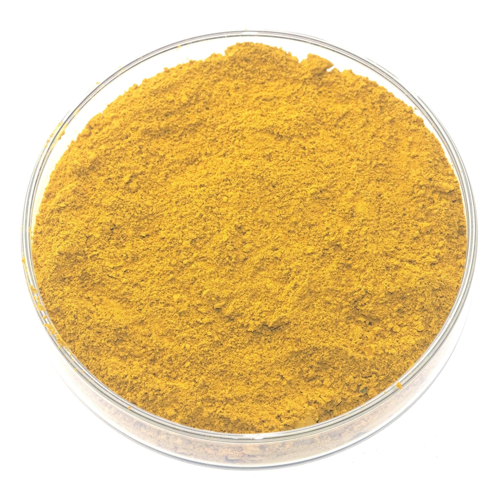 A glass bowl filled with a yellow substance, possibly a powder or spice, is shown in the image.