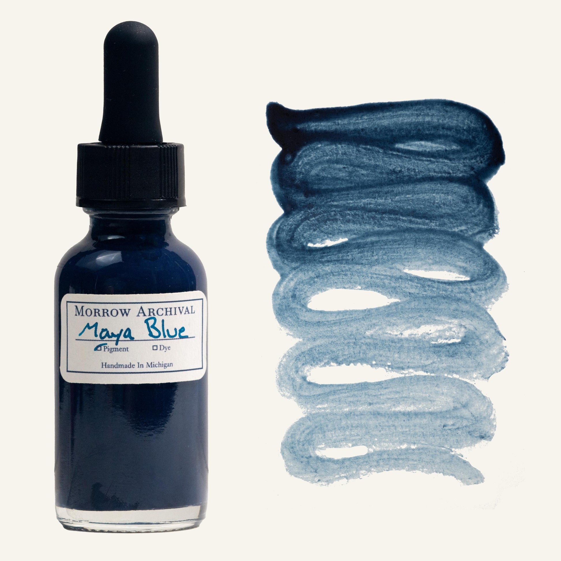 Authentic historical watercolor ink made from True Maya Blue, a blend of Indigofera suffruticosa and palygorskite clay, housed in a clear glass dropper bottle with a watercolor paper label and hand-painted swatch. This unique medium blue ink offers a soft, sky-toned hue with exceptional permanence and smooth flow. The swatch reveals a subtle gradient and natural matte texture. Archival quality, ideal for historical art, Mesoamerican-inspired work, and fine calligraphy.