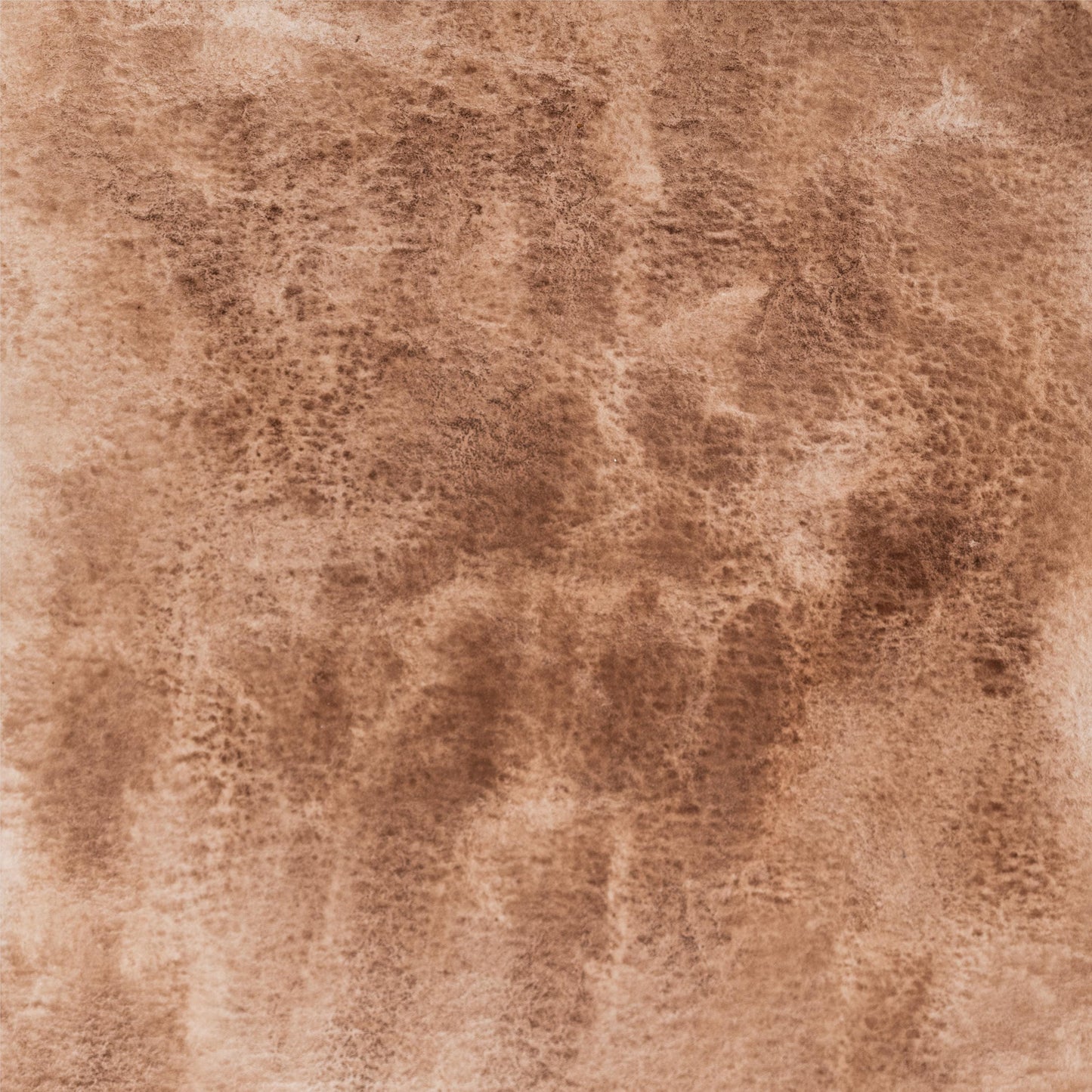 a close up of a Watercolor painting in earthy Brown Ochre, a natural iron oxide pigment mined from traditional deposits in France and Italy. Used in prehistoric cave art through Renaissance masterworks. Handcrafted with honey and gum arabic for professional artists. Excellent lightfastness and soft granulation. Ideal for landscapes, skin tones, and natural palettes.