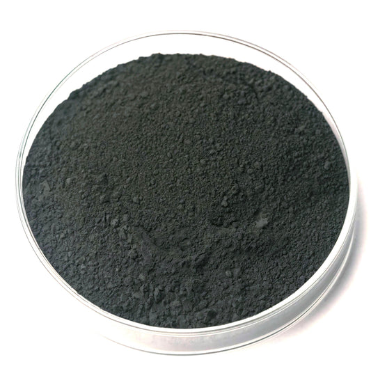 A glass container filled with a dark, powdery substance, possibly a type of coal or soil.