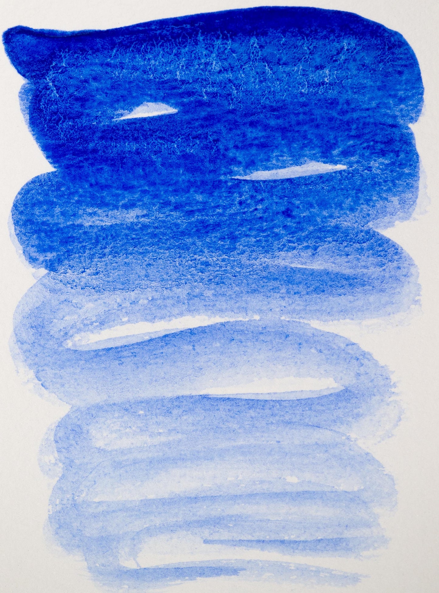 Hand-painted swatch of Fra Angelico Blue ink made from genuine lapis lazuli. The ultramarine tone shows subtle mineral texture and a flowing gradient from celestial blue to pale sky wash, capturing the elegance of this historic stone pigment.