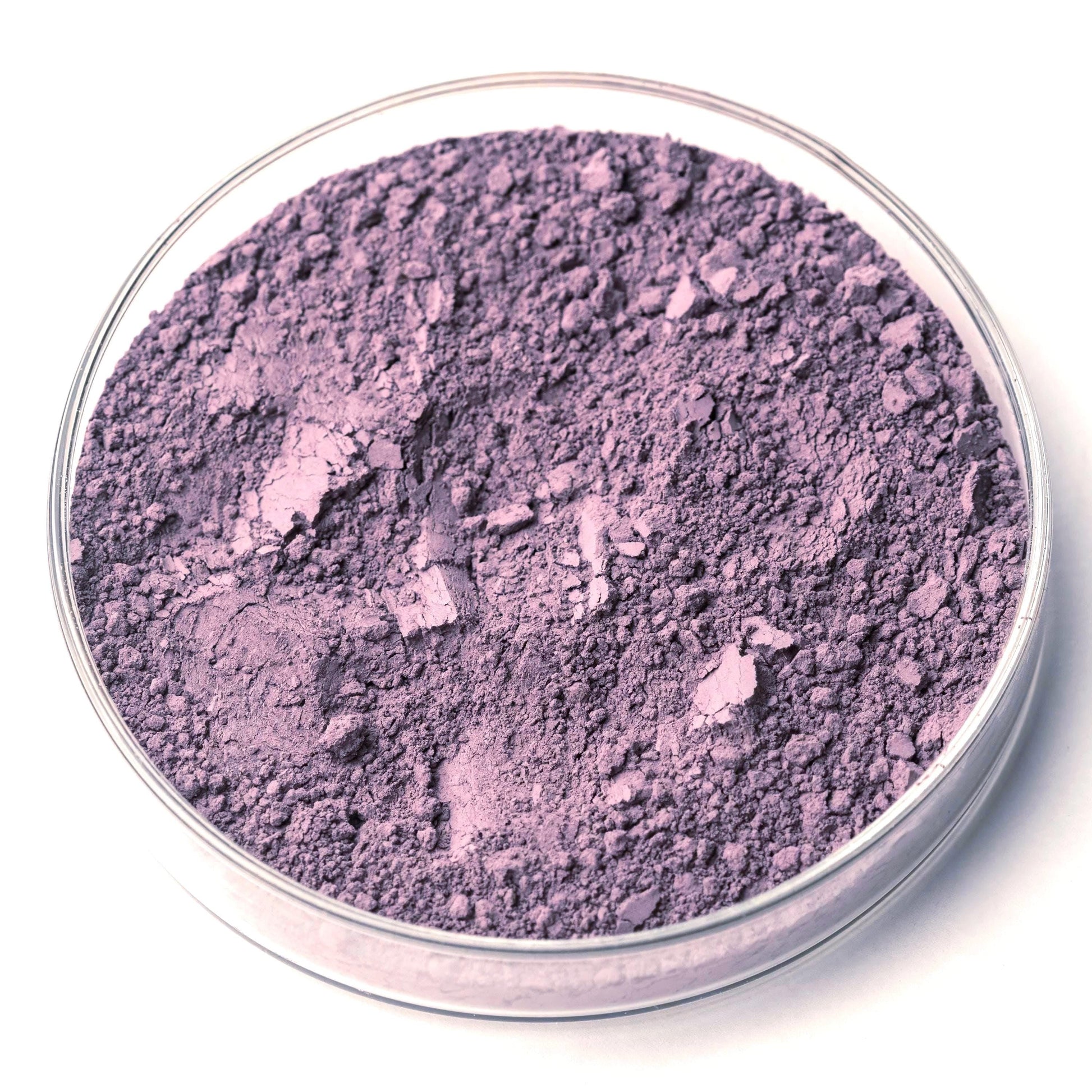 A glass container filled with a dark purple powder substance.