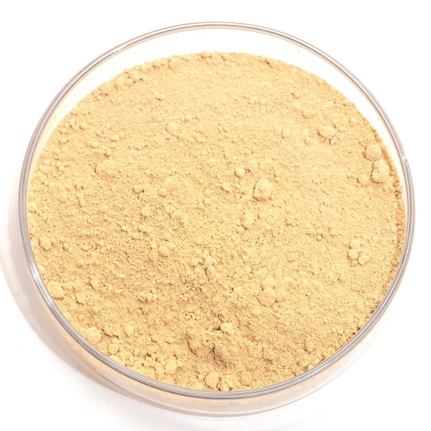 A glass bowl filled with a light brown, crumbly substance, possibly a type of flour or seasoning.